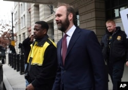 FILE - Rick Gates leaves federal court in Washington, Feb. 23, 2018.