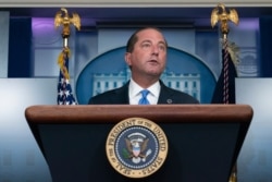 FILE - Health and Human Services Secretary Alex Azar said the new strategy would not interfere with Americans waiting for a first dose.