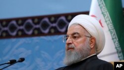 In this photo released by official website of the office of the Iranian Presidency, President Hassan Rouhani attends an annual Islamic Unity Conference in Tehran, Iran, Saturday, Nov. 24, 2018. 