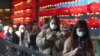 People wear face masks and walk at a shopping mall in Taipei, Taiwan, Jan. 31, 2020.