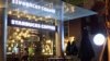 Workers prepare a Starbucks coffee shop for its opening in Vietnam's southern commercial hub of Ho Chi Minh City, July 30, 2013. 
