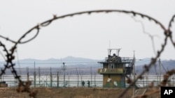 South Korean army soldiers patrol along the barbed-wire fence in Paju, near the border with North Korea, in South Korea. North Korea fired a suspected ballistic missile into the sea, the South Korean and Japanese militaries said.