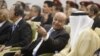 Yemen's President Abd-Rabbu Mansour Hadi (C) speaks with Gulf Cooperation Council (GCC) Secretary General Abdullatif al-Zayani during a ceremony in Sanaa November 19, 2012. 