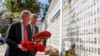 U.S. National Security Adviser John Bolton and U.S. Embassy Charge d'Affairs William Taylor attend a wreath-laying ceremony at the memorial for soldiers killed in a recent conflict in eastern Ukraine, in Kyiv, Ukraine, Aug. 27, 2019.
