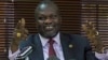 FILE - South Sudan's rebel leader Riek Machar gestures as he holds a press conference.