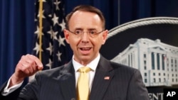 FILE - Deputy Attorney General Rod Rosenstein speaks to reporters, Feb. 16, 2018, in Washington.