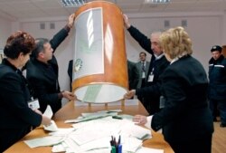 FILE - Local election officials empty a ballot box at a polling station in Tashkent, Uzbekistan, Dec. 23, 2007. The OSCE Office of Democratic Institutions and Human Rights is set to monitor the upcoming Uzbek elections.