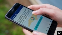 North Carolina' s cell phone app contact tracing SlowCOVIDNC is shown on Dec. 4, 2020, in Charlotte, N.C.