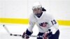 FILE - Julie Chu scrimmages with the U.S. Women's National Hockey team, National Sports Center, Blaine, Minnesota., Aug. 20, 2009.