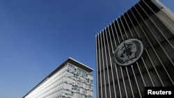 FILE - The headquarters of the World Health Organization in Geneva, Switzerland.