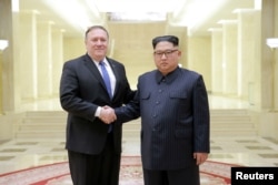 North Korean leader Kim Jong Un shakes hands with U.S. Secretary of State Mike Pompeo in this undated photo released on May 9, 2018 by North Korea's Korean Central News Agency (KCNA) in Pyongyang. KCNA/via REUTERS