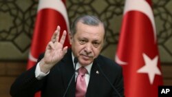FILE - Turkey's President Recep Tayyip Erdogan addresses local administrators, in Ankara, Feb. 8, 2017.