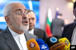 FILE - Iranian Foreign Minister Javad Zarif speaks with the media at the Europa building in Brussels, May 15, 2018.