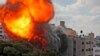 A ball of fire engulfs the Al-Walid building which was destroyed in an Israeli airstrike on Gaza city early in the morning, May 13, 2021.