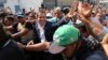 Venezuela's self-proclaimed president Juan Guaido greets supporters in Caracas, Venezuela, April 30, 2019.
