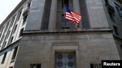 FILE - The front facade of the U.S. Department of Justice headquarters building is seen in Washington, July 13, 2018.