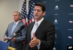 FILE - House Speaker Paul Ryan of Wisconsin, joined by House Majority Leader Kevin McCarthy of California, meets with reporters during a news conference on Capitol Hill in Washington, July 12, 2017.