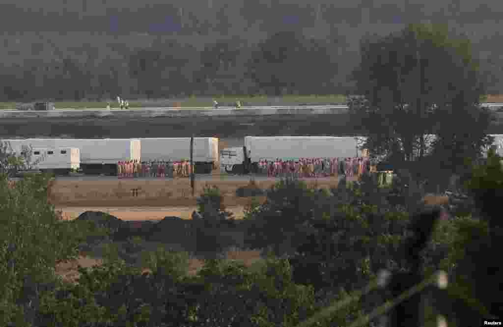Trucks of a Russian convoy said to be carrying humanitarian aid for people caught in the conflict in eastern Ukraine are seen parked outside the southwestern Russian city of Voronezh August 13, 2014.