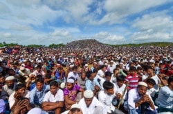 FILE - Rohingya refugees attend a ceremony to mark the second anniversary of the exodus at the Kutupalong refugee camp in Ukhia, August 25, 2019.