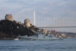 FILE - The Russian Navy's frigate Admiral Makarov sets sail in the Bosphorus, on its way to the Mediterranean Sea, in Istanbul, Turkey, Feb. 28, 2020.