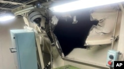 This photo provided by the Philippine Coast Guard, shows damage in the auxiliary room on the port side near the port auxiliary engine of Philippines coast guard vessel BRP Bagacay after a collision with a Chinese ship Aug. 19, 2024 in the disputed South China Sea. 