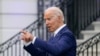 President Joe Biden speaks with an attendee during an Independence Day celebration on the South Lawn of the White House, Sunday, July 4, 2021, in Washington. (AP Photo/Patrick Semansky)