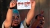 An election official holds up a ballot paper during the counting of votes cast in the country's presidential election, in Makassar, South Sulawesi, Indonesia, July 9, 2014. 