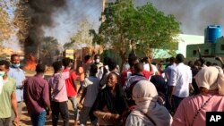 Anti-government protesters rally in Khartoum, Sudan, Sunday, Jan. 13, 2019. 