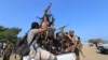 FILE - Houthi militants ride on the back of a truck in the Red Sea city of Hodeidah, Yemen, Dec. 29, 2018. 