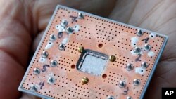 Photo shows a seven cubit quantum device is seen at the IBM Thomas J. Watson Research Center in Yorktown Heights, N.Y. 