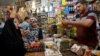 People shop for the Muslim fasting month of Ramadan at the Shorja wholesale market in central Baghdad, Iraq, June 6, 2016. 