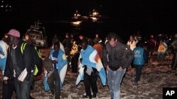 Migrants arrive on the tiny island of Lampedusa, Italy, May 8, 2011. However, in 2009, Italian vessels intercepted three boats carrying sub-Saharan migrants from Libya. The migrants were returned to Libya triggering an appeal to Europe's human rights cour