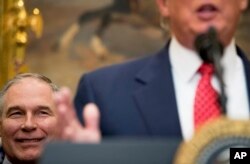 FILE - EPA administrator Scott Pruitt listens as President Donald Trump speaks in the Roosevelt Room of the White House, in Washington, Feb. 28, 2017.
