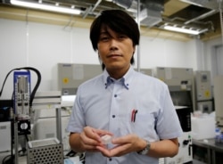 Osaka University Professor Michiya Matsusaki shows off cultured Wagyu beef at a lab at the university in Suita, Osaka PrefectureREUTERS/Akira Tomoshige