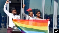 Activists celebrate the High Court's ruling to decriminalize gay sex outside the High Court in Gaborone, Botswana, June 11, 2019. 