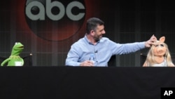 Kermit the Frog, writer/executive producer Bob Kushell and Miss Piggy participate in a panel presentation for "The Muppets" at the Disney/ABC Summer TCA Tour at the Beverly Hilton Hotel in Beverly Hills, Calif., Aug. 4, 2015. 