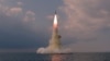 북한이 지난해 10월 19일 신형 잠수함발사탄도미사일(SLBM)을 시험발사했다며 공개한 사진.