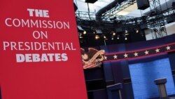 Workers prepare for the first presidential debate between U.S. President Trump and Democratic nominee Biden in Cleveland, Ohio