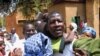 FILE - Niger journalist Moussa Kaka (C) is surrounded by supporters in Niamey, Oct. 7, 2008, after an appeals court ordered his provisional release just over a year since his detention for allegedly undermining state security. 