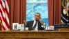 U.S. President Barack Obama speaks with Iranian President Hassan in this official White House photo released Sept. 27, 2013.