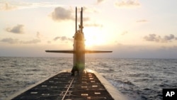 FILE - The ballistic-missile submarine USS Wyoming is seen in the Atlantic, in this photo released by the U.S. Navy Jan. 9, 2008. The U.S. military says it is deploying long-range missiles armed with a nuclear warhead of reduced destructive power.