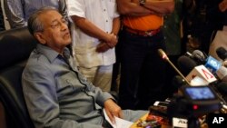 FILE - former Malaysian prime minister Mahathir Mohamad speaks at a press conference in Putrajaya, Malaysia, Feb. 29, 2016. Mahathir has filed a lawsuit against his successor Najib Razak accusing him of corruption.