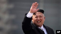 FILE - North Korean leader Kim Jong Un waves during a military parade in Pyongyang, North Korea.