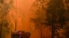 Firetrucks are seen during a bushfire in Werombi, 50 km southwest of Sydney, Dec. 6, 2019.