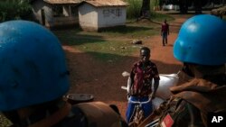 FILE - U.N. peacekeepers patrol the town of Bangassou, Central African Republic, Feb. 15, 2021. 