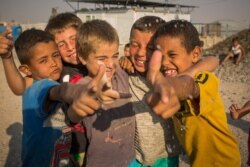 Hundreds of children of IS militants have died in or on their way to al-Hol camp this year, pictured on Aug. 26, 2019 in al-Hol Camp, Syria. (VOA/Yan Boechat)