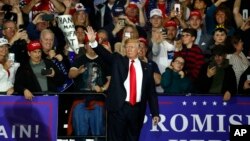 U.S. President Donald Trump waves after a campaign rally in Washington Township, Michigan, April 28, 2018.