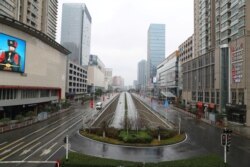 Street view after Wuhan government announced to ban non-essential vehicles in downtown area to contain coronavirus outbreak, on the second day of the Chinese Lunar New Year, in Wuhan, Hubei province, China January 26, 2020. cnsphoto via REUTERS…
