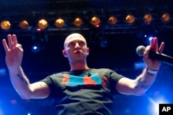 Rapper Oxxxymiron, whose real name is Miron Fyodorov, performs during a concert in support of rapper Husky, whose real name is Dmitry Kuznetsov, in Moscow, Nov. 26, 2018. Some of Russia's popular rap artists got together in Moscow for a charity show in a sign of solidarity for Husky who was sentenced to 12 days in jail for performing on a car. Husky's arrest, however, was hastily canceled and he was released.