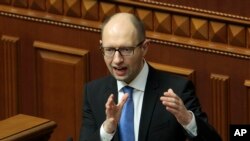 Ukrainian Prime Minister Arseniy Yatsenyuk, speaks to lawmakers during a session at the Ukrainian parliament in Kyiv.